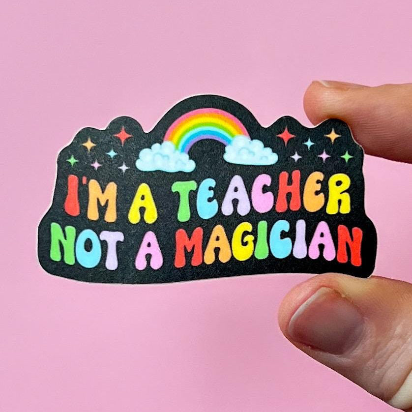 Sticker with 'I'm a teacher not a magician' text on a pink background