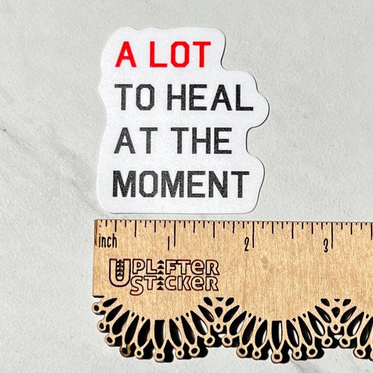 A lot to heal at the moment sticker, therapy sticker, swiftie therapist sticker, mental health sticker, social work sticker