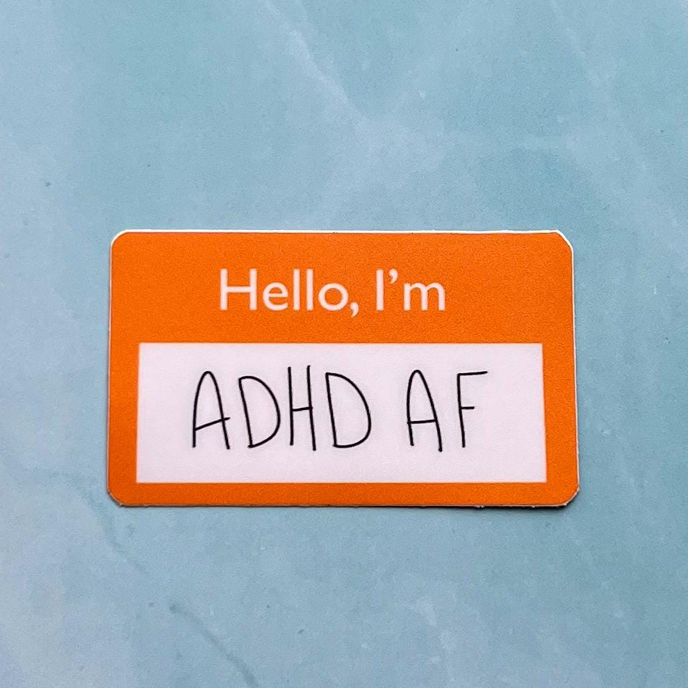 sticker with 'Hello, I'm ADHD AF' text on a light blue background