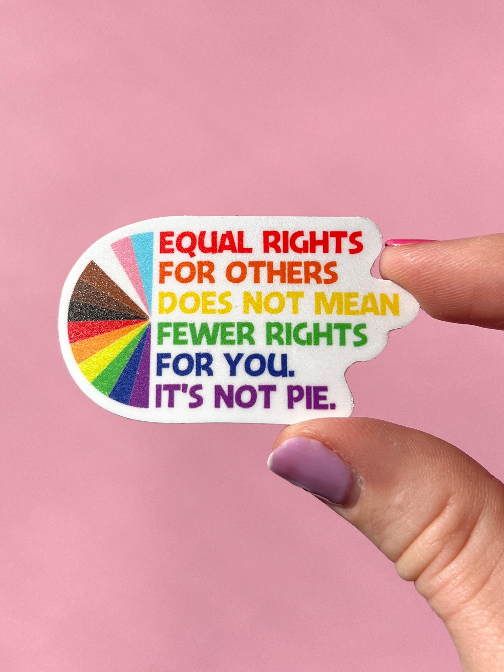 Sticker with rainbow-colored text on a pink background