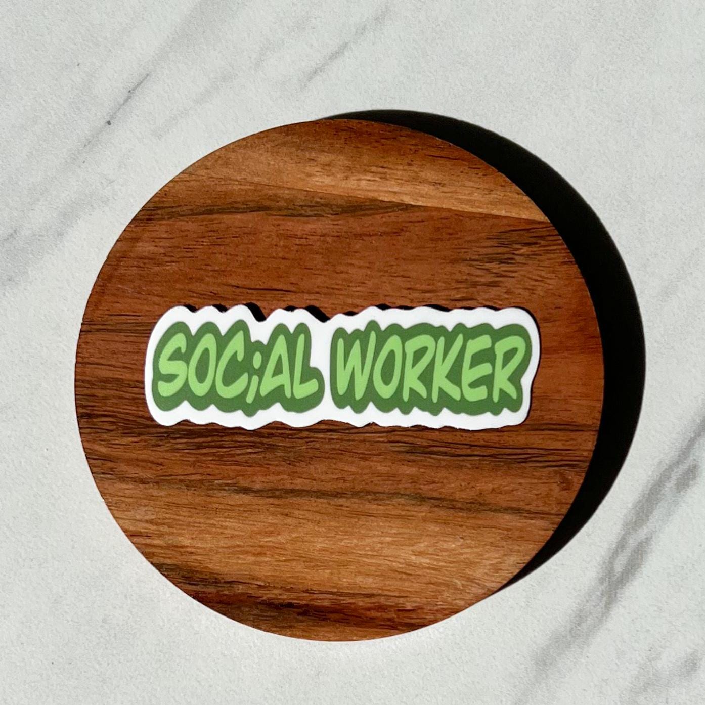 Wooden coaster with a 'SOCIAL WORKER' sticker on a gray background