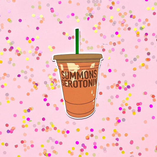 Illustration of a coffee cup with 'SUMMONS SEROTONIN' text on a pink background with colorful confetti.